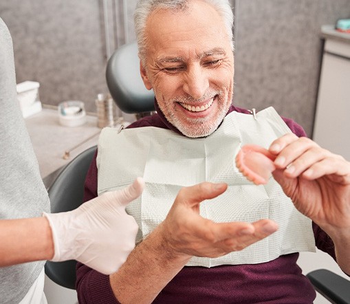 Dentist discussing the cost of dentures in West Palm Beach 